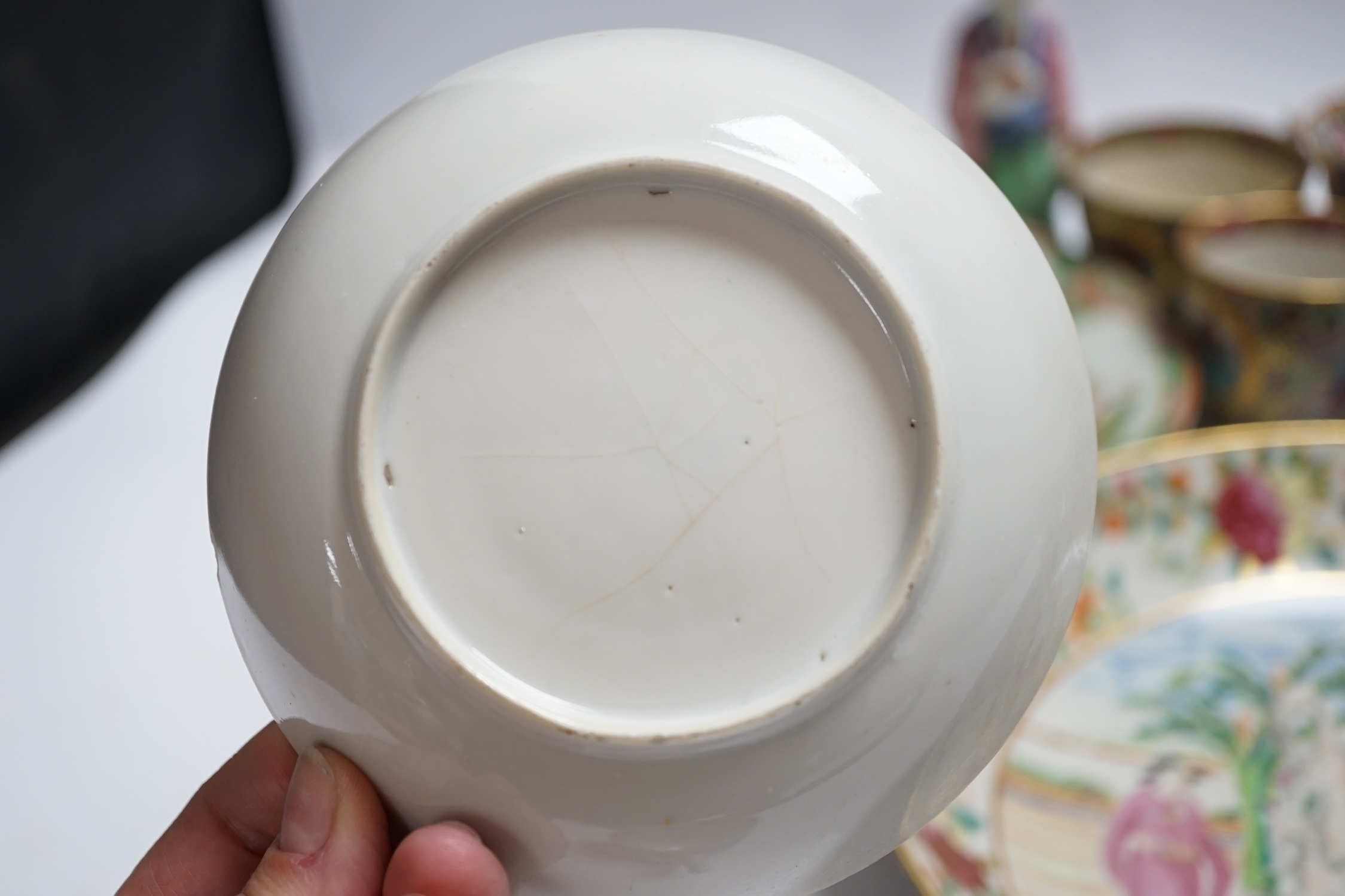Chinese famille rose porcelain including plates, cups, saucers and a figure, 18th and 19th century, largest 27cm diameter